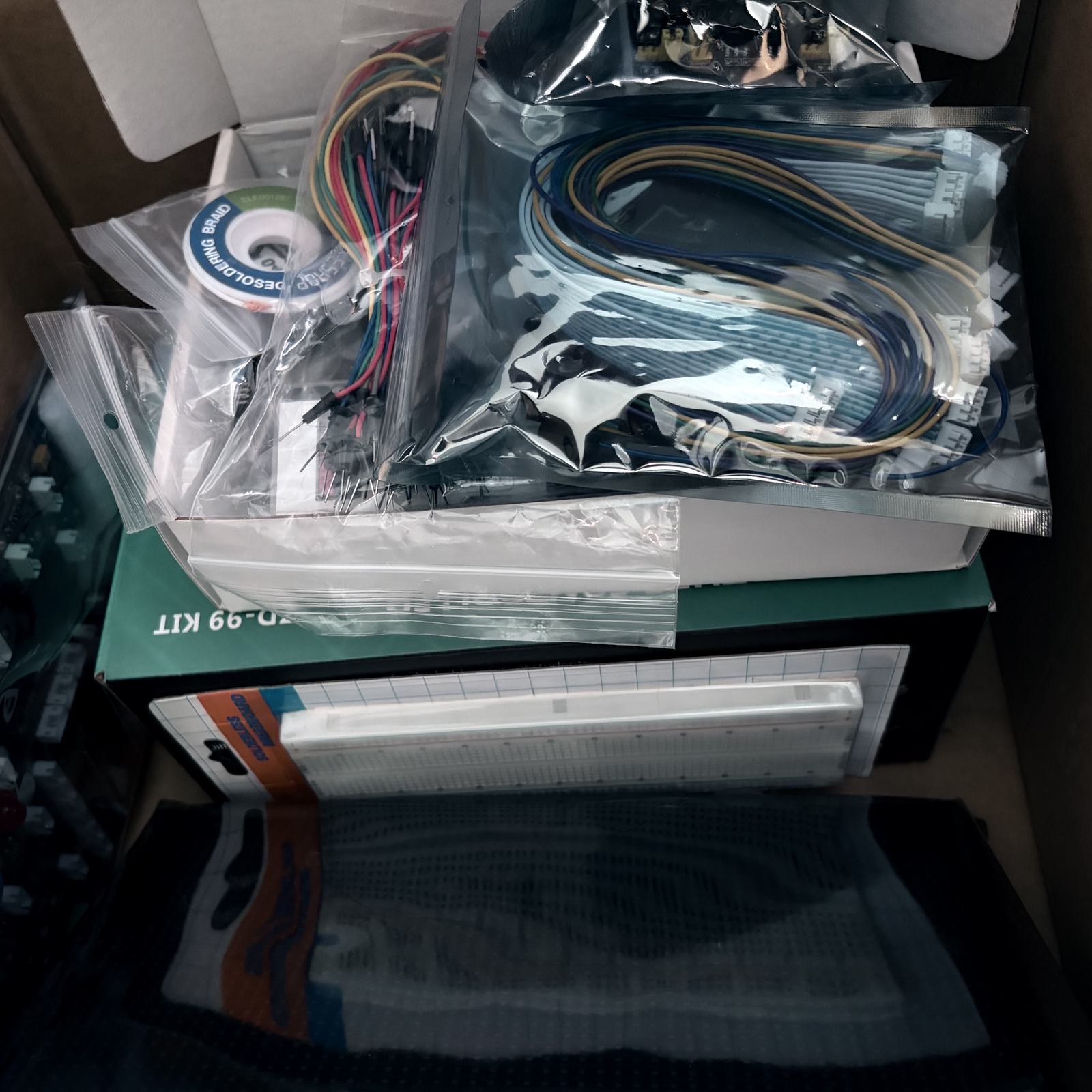 A lot of small electronics for DIY and learning kits like ESP32-S3, small amoled or e-paper screens, soldering materials